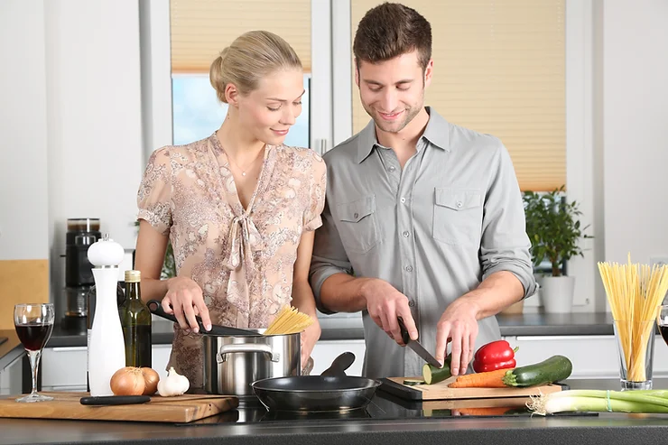 Couple cooking a healthy meal together in the kitchen