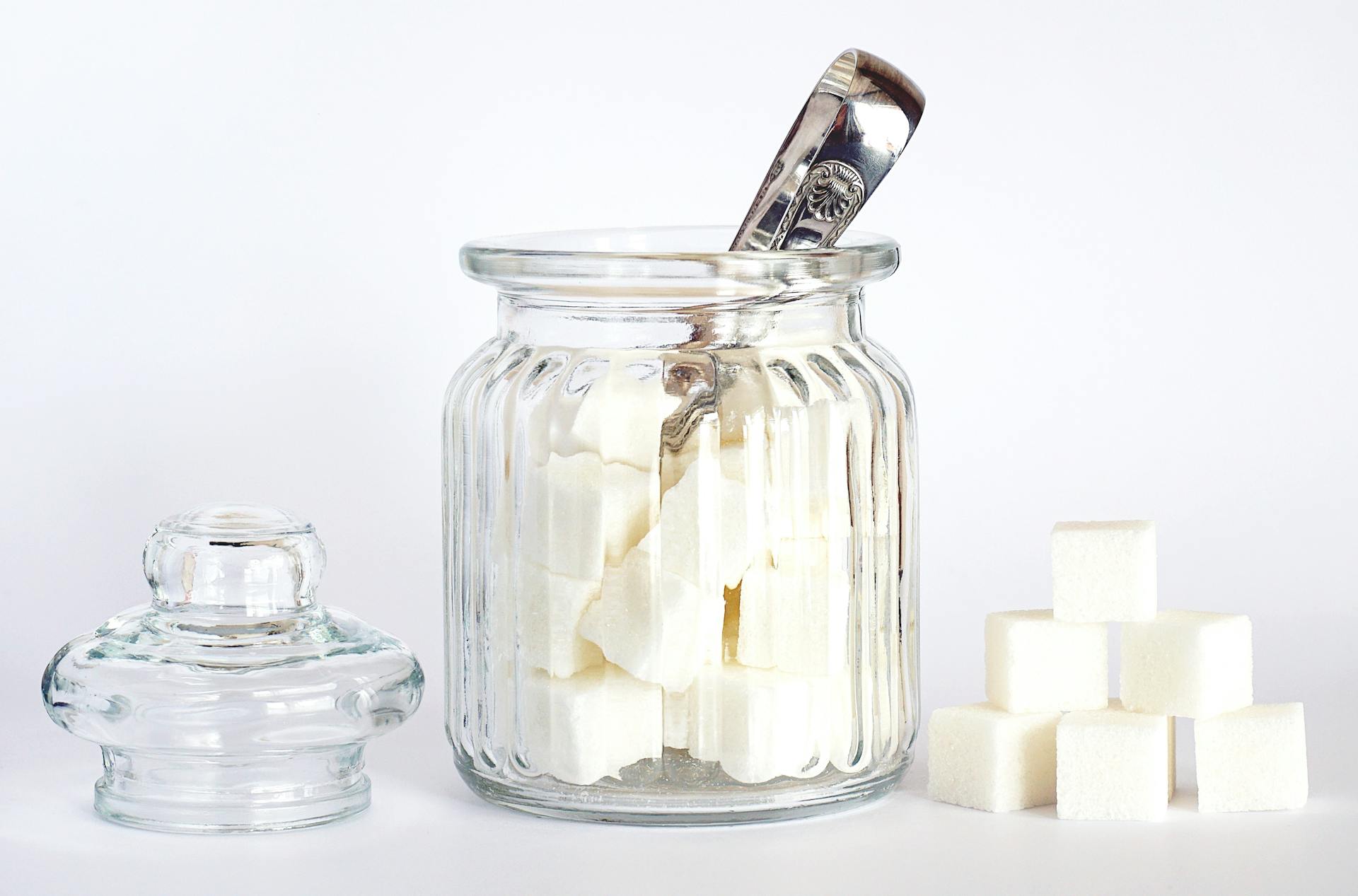 Image of sugar bowl with tongs and sugar cubes