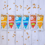 Image of several packages of the Good Bean crispy chickpeas in a variety of flavors